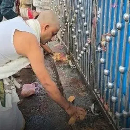 Devotees perform pujas before closed gates of Vemulawada temple